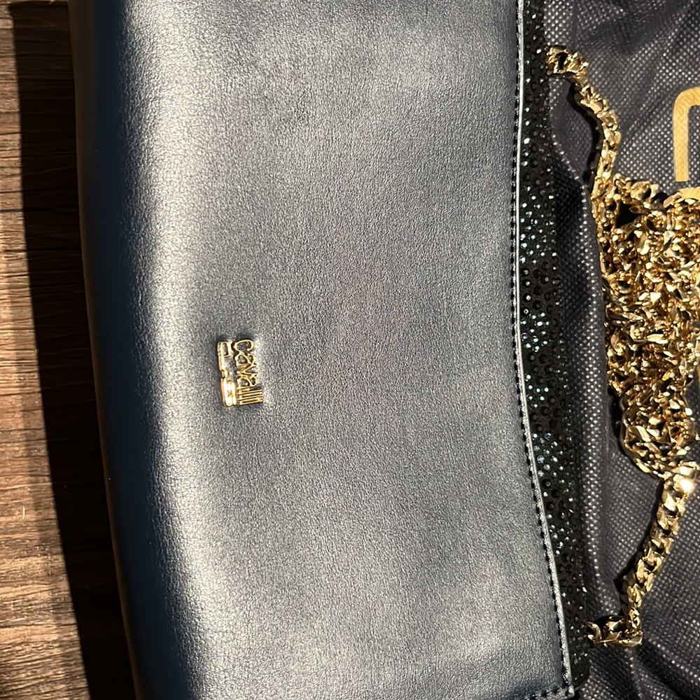 Blue and black with a animal pattern design with crystal like studs on it - Picture 2 of 2